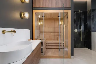 a bathroom with a sink and a shower at AC - Sauna - 3 Bedroom Ap - Starowiślna 29 in Kraków