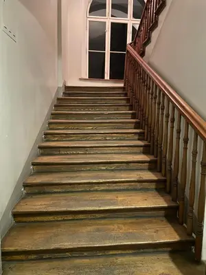 a set of stairs in a building with a window at Hostel Uno-No Alkohol! Only Comfort Age Limit 18 until 55! in Kraków