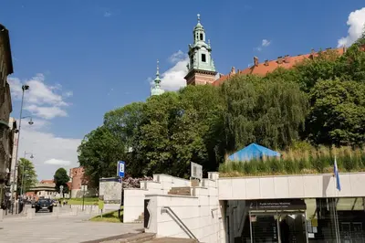 a building with a clock tower in the background at Wawel Castle across the street! Ozonated Apartment in Kraków
