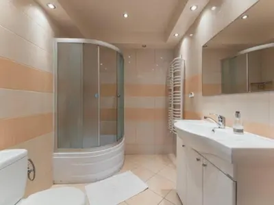 a bathroom with a shower and a sink and a toilet at Nocleg Wadowice in Wadowice