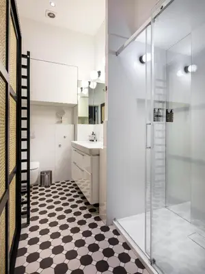 a bathroom with a shower and a toilet and a sink at Bracka by Tyzenhauz in Kraków