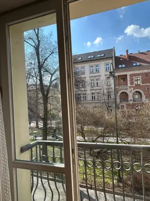 a window with a view of a building at Retoryka Apt in Kraków