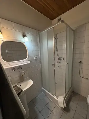 a bathroom with a shower and a sink at Pensjonat Rezydencja Zuzanna Bed&Breakfast Sucha Beskidzka in Sucha Beskidzka