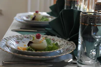 a table with two plates of food on a table at Pensjonat Rezydencja Zuzanna Bed&Breakfast Sucha Beskidzka in Sucha Beskidzka