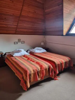 two beds sitting next to each other in a room at Pensjonat Rezydencja Zuzanna Bed&Breakfast Sucha Beskidzka in Sucha Beskidzka