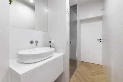 a white bathroom with a sink and a shower at Ucieknij do luksusu Villa Wola2 in Kraków