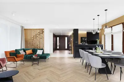 a living room with a couch and a table and chairs at Ucieknij do luksusu Villa Wola2 in Kraków