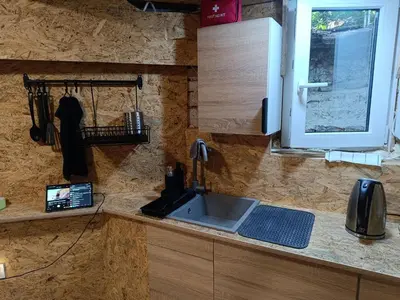 a kitchen counter with a sink and a window at pokój kapsułowy #3 centrum in Kraków