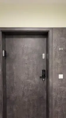 a metal door with the number on it at Royal Blue Place Cracow in Kraków
