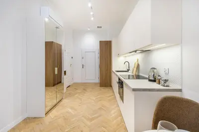 a kitchen with a sink and a counter top at Apartament Długa 24 in Kraków