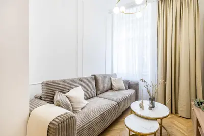 a living room with a couch and a table at Apartament Długa 24 in Kraków