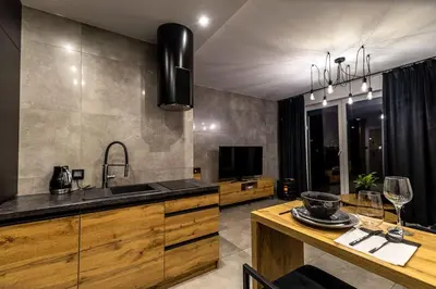 a kitchen with a sink and a counter at Exclusive place with underground parking and terrace in Oświęcim
