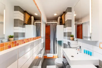 a bathroom with a sink and a toilet at Park Krakowski Loft Apartment by BookingHost in Kraków