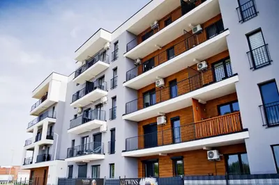 an image of an apartment building with balconies at Magic Apartments - Zibi in Zator