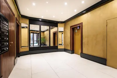 an empty hallway of a building at City of the Kings-Copper Nest in Kraków
