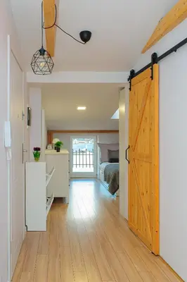 a room with a door leading to a bedroom at Scandi-Style Escape in Krakow in Kraków