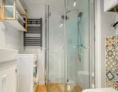 a glass shower in a bathroom with a toilet at Scandi-Style Escape in Krakow in Kraków