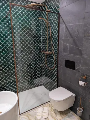 a bathroom with a shower with a toilet and a sink at Płachtówka in Słupia