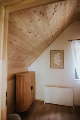 a room with a wooden ceiling at Osada Zawadka in Zawadka