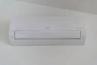 a microwave oven sitting on top of a white wall at Wielopole Top Floor Apartments by Hostly in Kraków