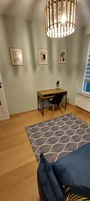 a living room with a couch and a table at Secret Room Niepołomice in Niepołomice
