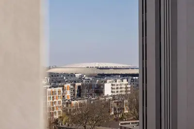 a view of a stadium from a window of a building at Elegant Apartment with Parking near Tauron Arena Kraków by Noclegi Renters in Kraków