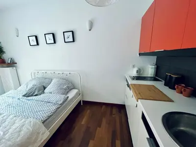 a bathroom with a shower toilet and a sink at Cozy apartment railway station in Kraków