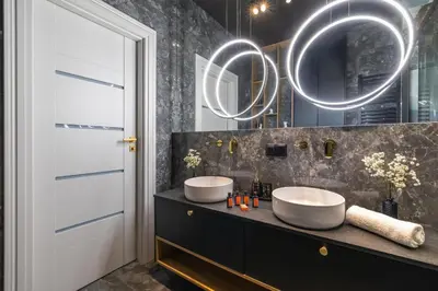 a bathroom with two sinks and a mirror at Starowiślna Elegant Apartment with Air Conditioning Kazimierz Cracow by Renters Prestige in Kraków