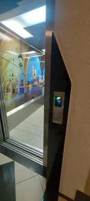 a mirror in a building with a view of the city at Apartament ZARA Self Check In in Kraków