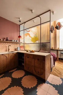 a kitchen with a large aquarium in the middle at Soho Residence Kazimierz by Downtown Apartments in Kraków