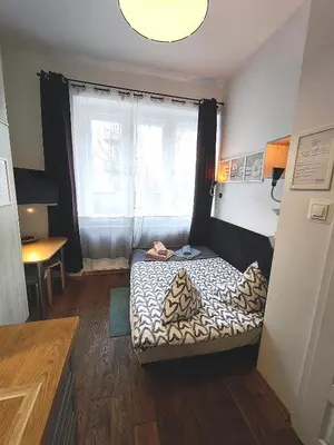 a bathroom with a shower and a toilet and a sink at Nowy Kleparz 3 in Kraków