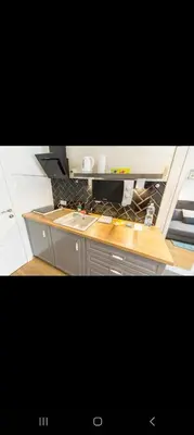 a kitchen with a counter top and a sink at Nowy Kleparz 3 in Kraków