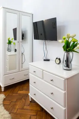 a bedroom with a green bed with two pillows on it at Verde 2-room in the center in Kraków