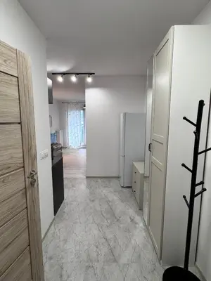 an empty room with a door and a hallway at Apartamenty przy Malborskiej in Kraków