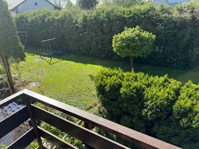 a view of a garden from the balcony of a house at Blue Zone Apartment with FREE Parking, Balcony and Garden in Kraków