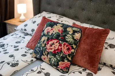 a small bedroom with a bed with a window at ATLAS apartment in the center in Kraków