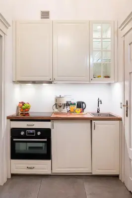 a dining room with a table with a vase of flowers at ATLAS apartment in the center in Kraków