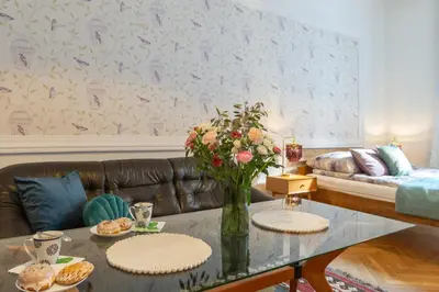 a bedroom with a bed with two towels on it at Cherish Bloom in Kraków