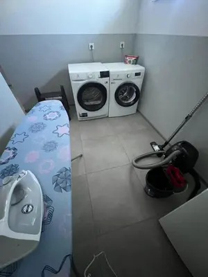 a small room with a washing machine and a washer at Widokowy zakątek niedaleko Energylandi Zator in Zator