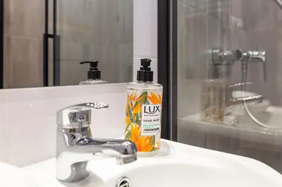 a bathroom with a shower with a glass door at Great base to explore Cracow in Kraków