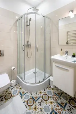 a bathroom with a shower and a toilet and a sink at Mint&Jade studio C in Kraków