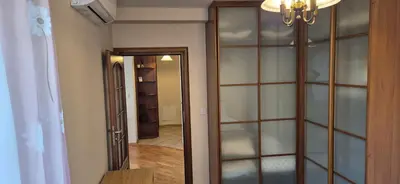 a room with a closet with a glass wall at Apartment with terrace and garage in Kraków