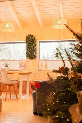 a bedroom with two beds in a wooden cabin at Domki Pod Halą Krupowa - Domek Zawoja in Sidzina