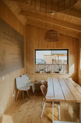 a kitchen with a wood stove in the middle at Domki Pod Halą Krupowa - Domek Zawoja in Sidzina