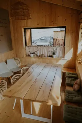 a room with a staircase in a log cabin at Domki Pod Halą Krupowa - Domek Zawoja in Sidzina