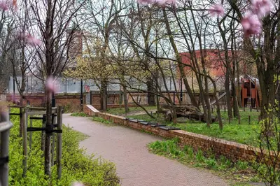 a river with a fence and trees and a building at Malila Premium Apartments Cracow Rakowicka 20L- 453 in Kraków