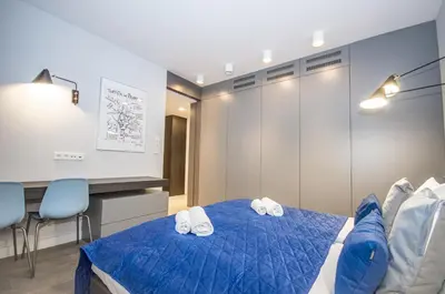 a hotel room with two beds in a room at Family Apartment with 2 bedrooms, huge balcony, Free parking, 10 minutes walk to Main Square and Kazimierz District in Kraków