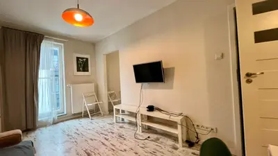 a room with a bed and a sliding door at Ślusarska Street in Kraków