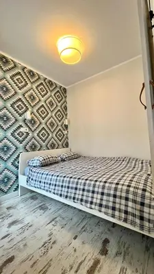 a small living room with a couch and a tv at Ślusarska Street in Kraków