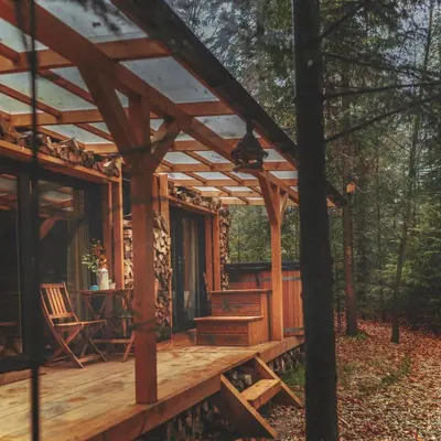 a cabin in the woods with a solar roof at Domki pod Halą Krupową - Tiny House w Lesie in Sidzina